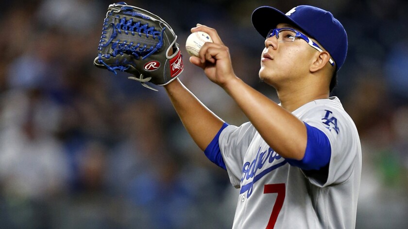 Dodgers rookie Julio Urias catches his breath while pitching against the Yankees in New York on Sept. 13.