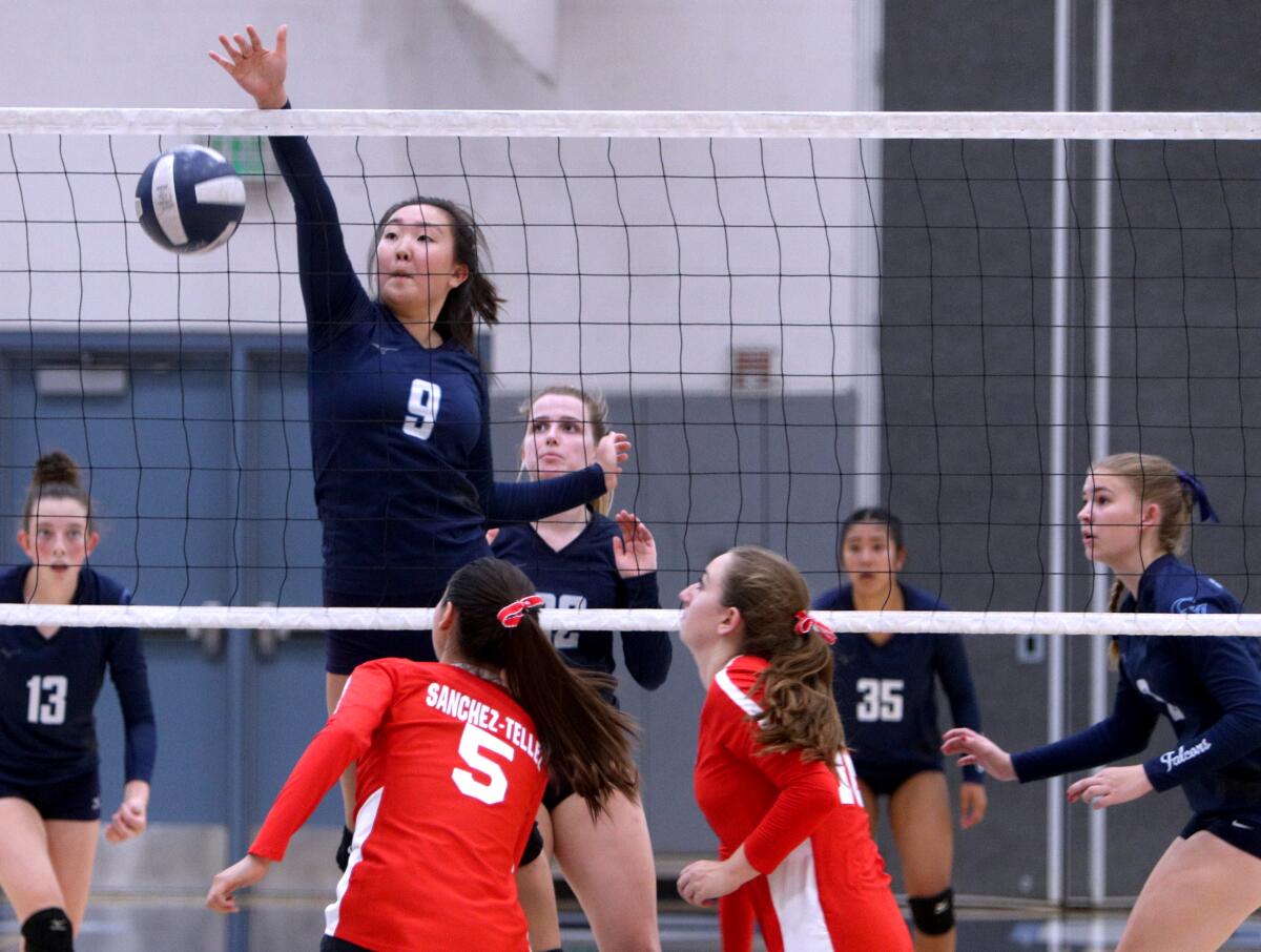 Crescenta Valley High School volleyball player Ellie Song drops one over the net in home game vs. Burroughs High School, in La Crescenta on Thursday, Sept. 12, 2019.