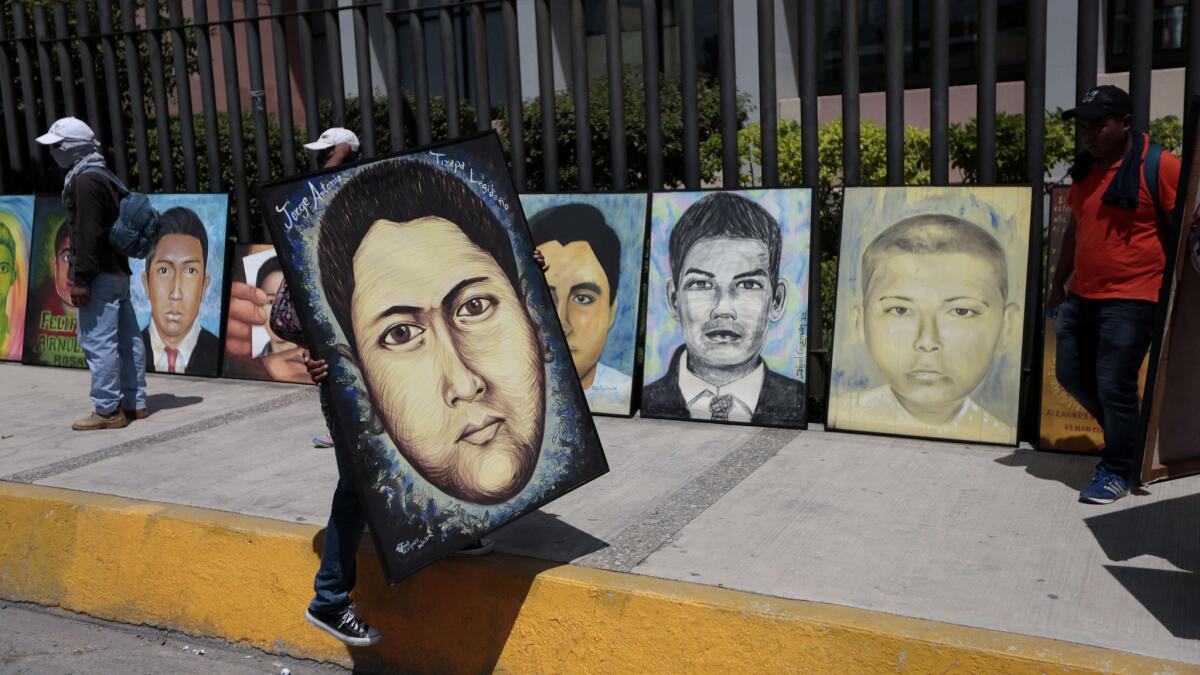 The protests have also generated plenty of paintings — generally portraits of the missing — often executed in a brightly hued folk style. Seen here: portraits of the missing in front of Guerrero's state assembly, located in the city of Chilpancingo.