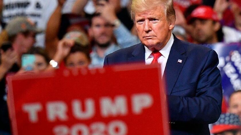 President Trump stands inside the Amway Center in Orlando, Fla., on Tuesday night, when he officially launched his 2020 reelection campaign.