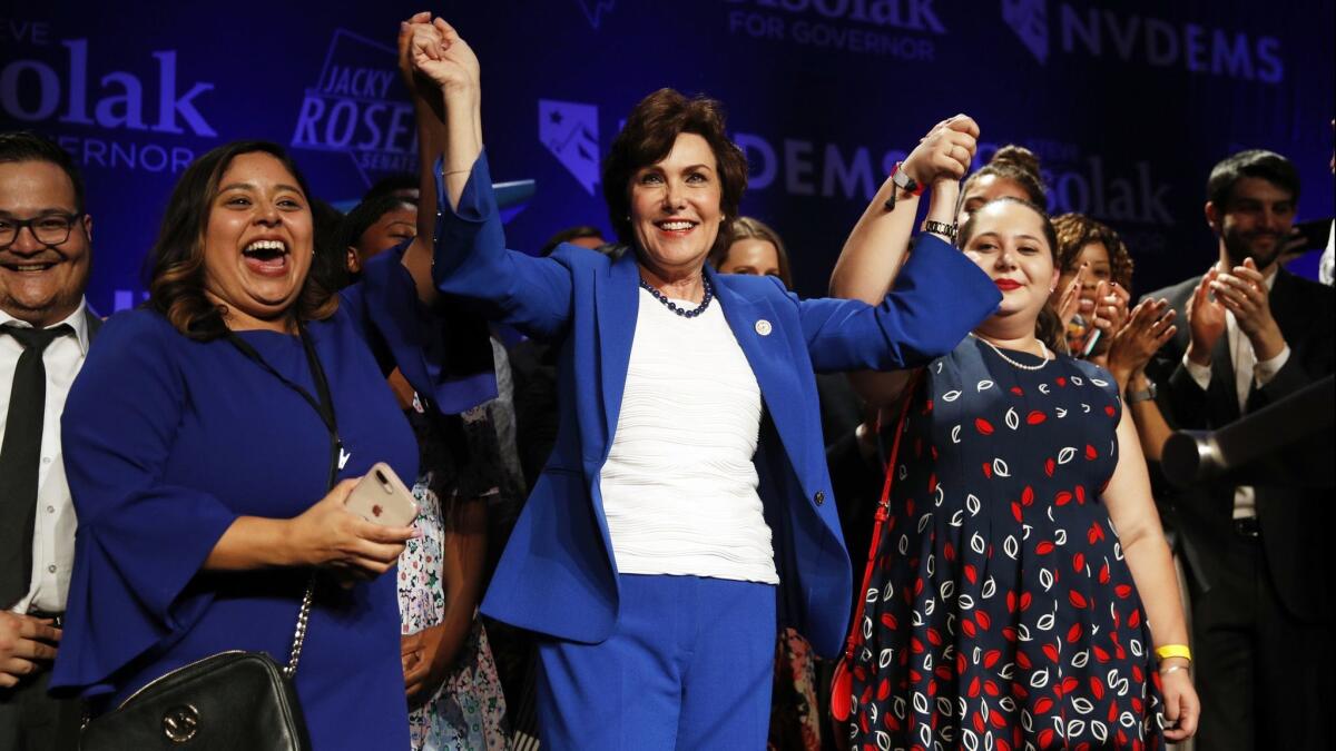 Rep. Jacky Rosen, D-Nev., center, celebrates at a Democratic election night party after winning a Senate seat in Las Vegas on Nov. 7.