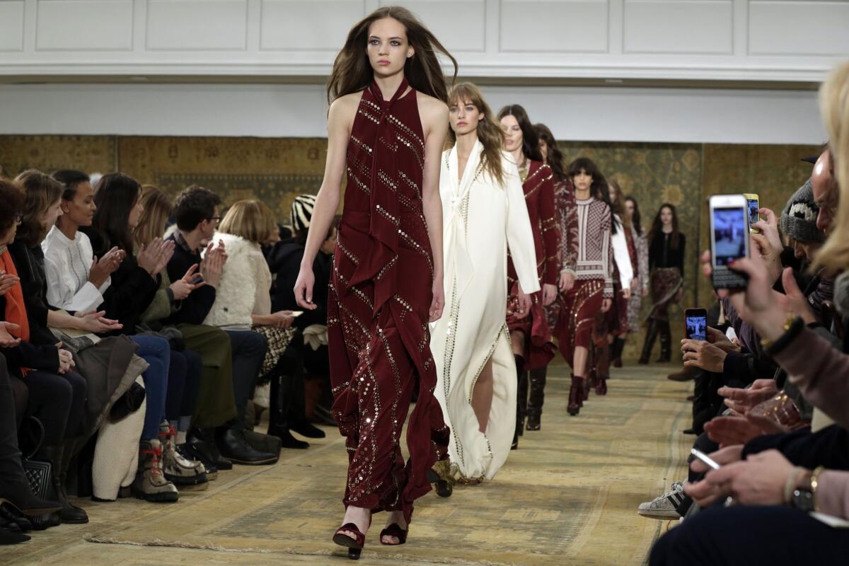 Models walk in the finale of the Tory Burch show during the 2015 New York Fashion Week.