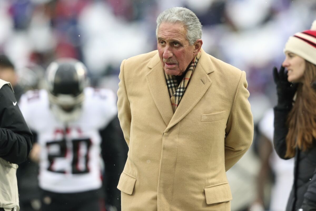 FILE - Atlanta Falcons owner Arthur Blank watches his players warm up before an NFL football game against the Buffalo Bills on Sunday, Jan. 2, 2022, in Orchard Park, N.Y. Falcons owner Arthur Blank says the team must have a succession plan at quarterback even while counting on Matt Ryan to continue as the starter in 2022. (AP Photo/Joshua Bessex, File)