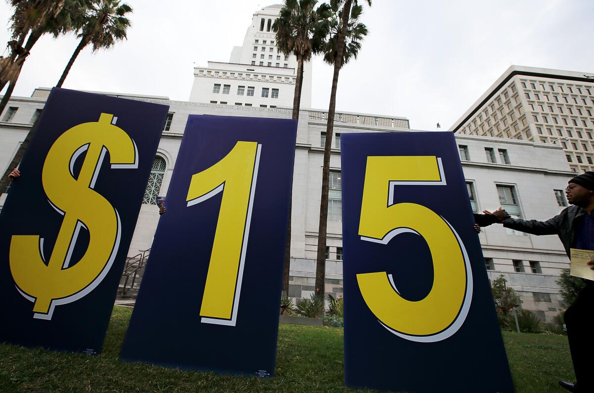 A coalition of workers, business and civic leaders rally outside Los Angeles City Hall on Jan. 30 to push for an increase in the minimum wage.