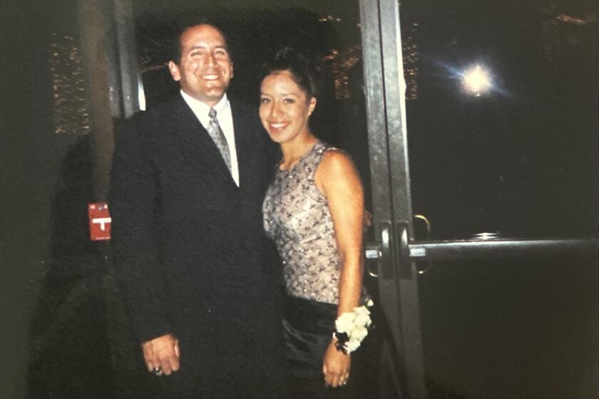 Michael Guzman, left, and Clarissa Vizcaino, right, stand together at Vizcaino's high school prom.
