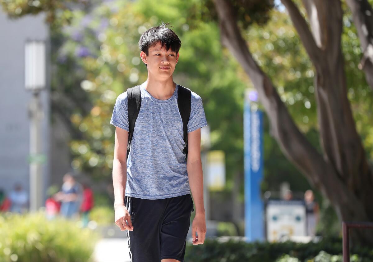 Student Tycho Elling walks the pathways at UC Irvine.