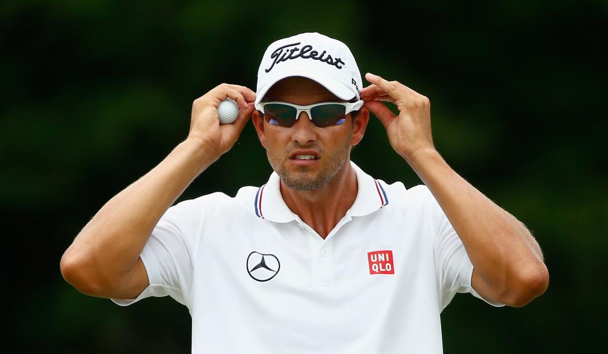 Adam Scott waits on a green during the final round of the Players Championship in Ponte Vedra Beach, Fla.