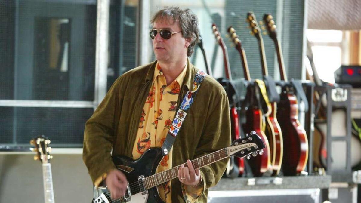 R.E.M. guitarist Peter Buck has sold his high-rise condo in downtown Seattle for $1.25 million.