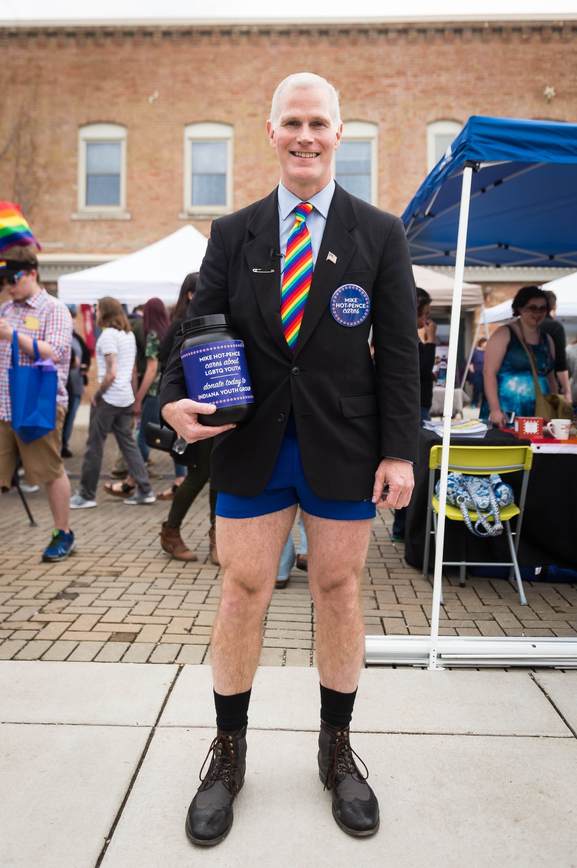 Glen Pannell, a Mike Pence lookalike, wears hot pants with a jacket and tie while acting as "Mike Hot-Pence."