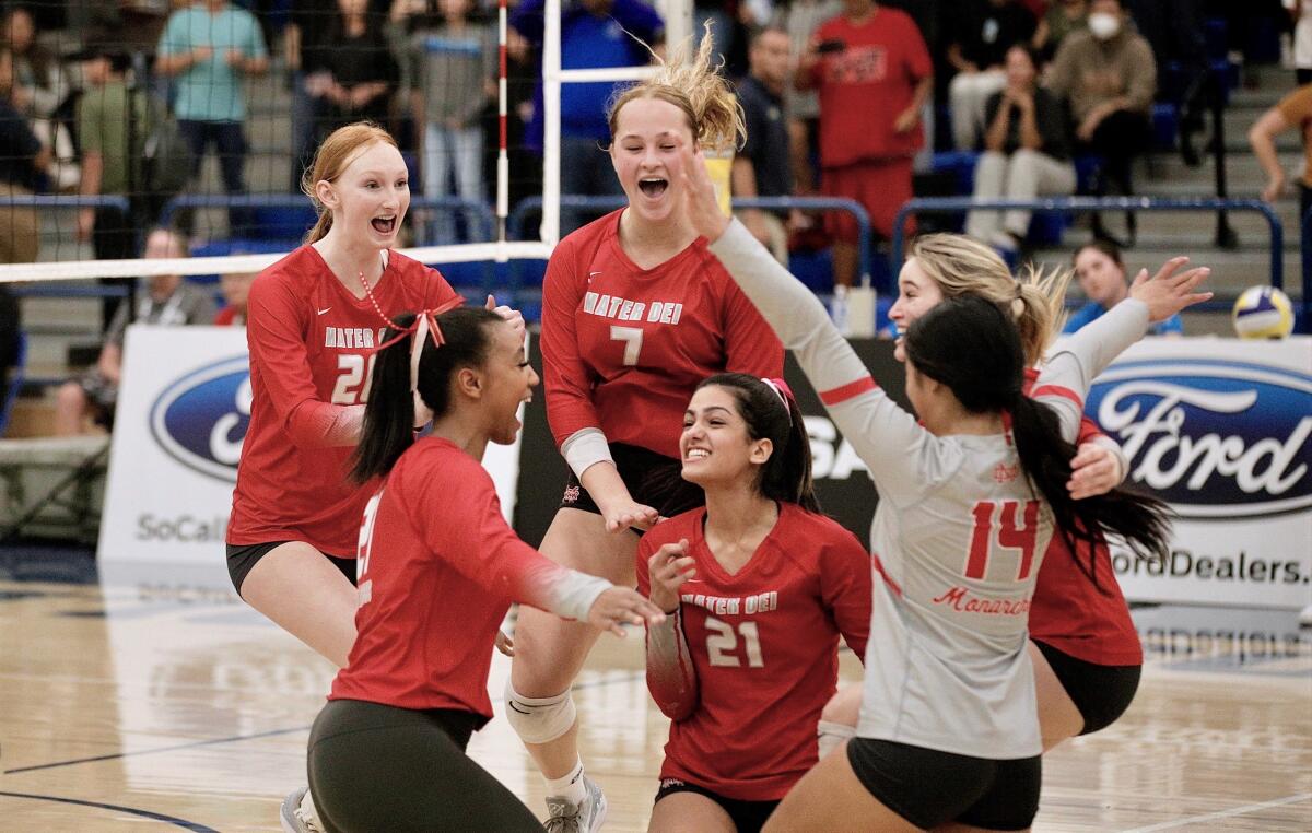 Mater Dei players celebrate after an ace on championship point Saturday gave them the Southern Section Division 1 title.