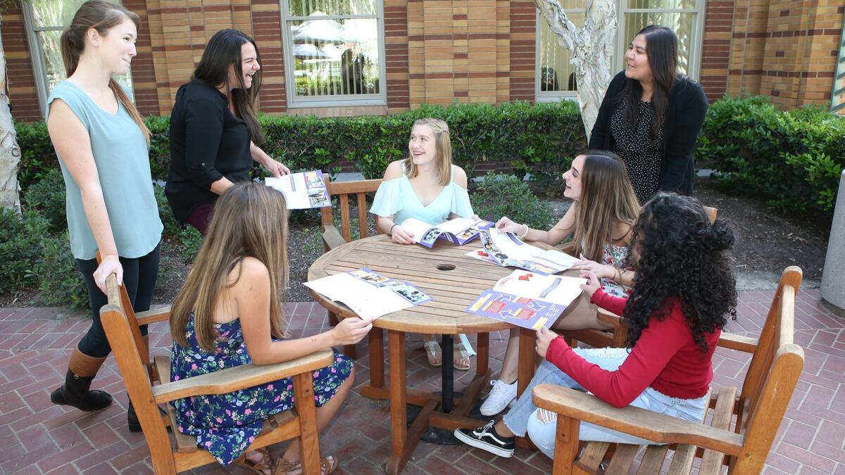 Healthy Emotions & Attitudes in Relationships Today team members chat with teen volunteers at Laura's House in Ladera Ranch. Chapman University's study of dating violence was completed for Laura's House.