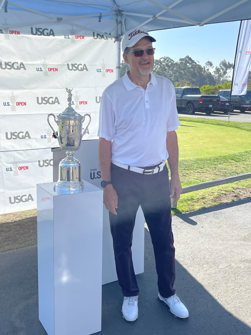 Hughie Thomas of Solana Beach poses with U.S. Open trophy Sunday at Balboa Park Golf Course.