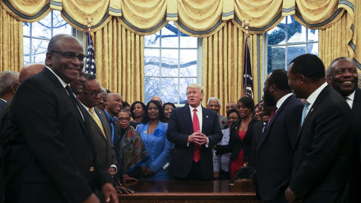 President Trump addresses officials from historically black colleges and universities in the Oval Office in February.