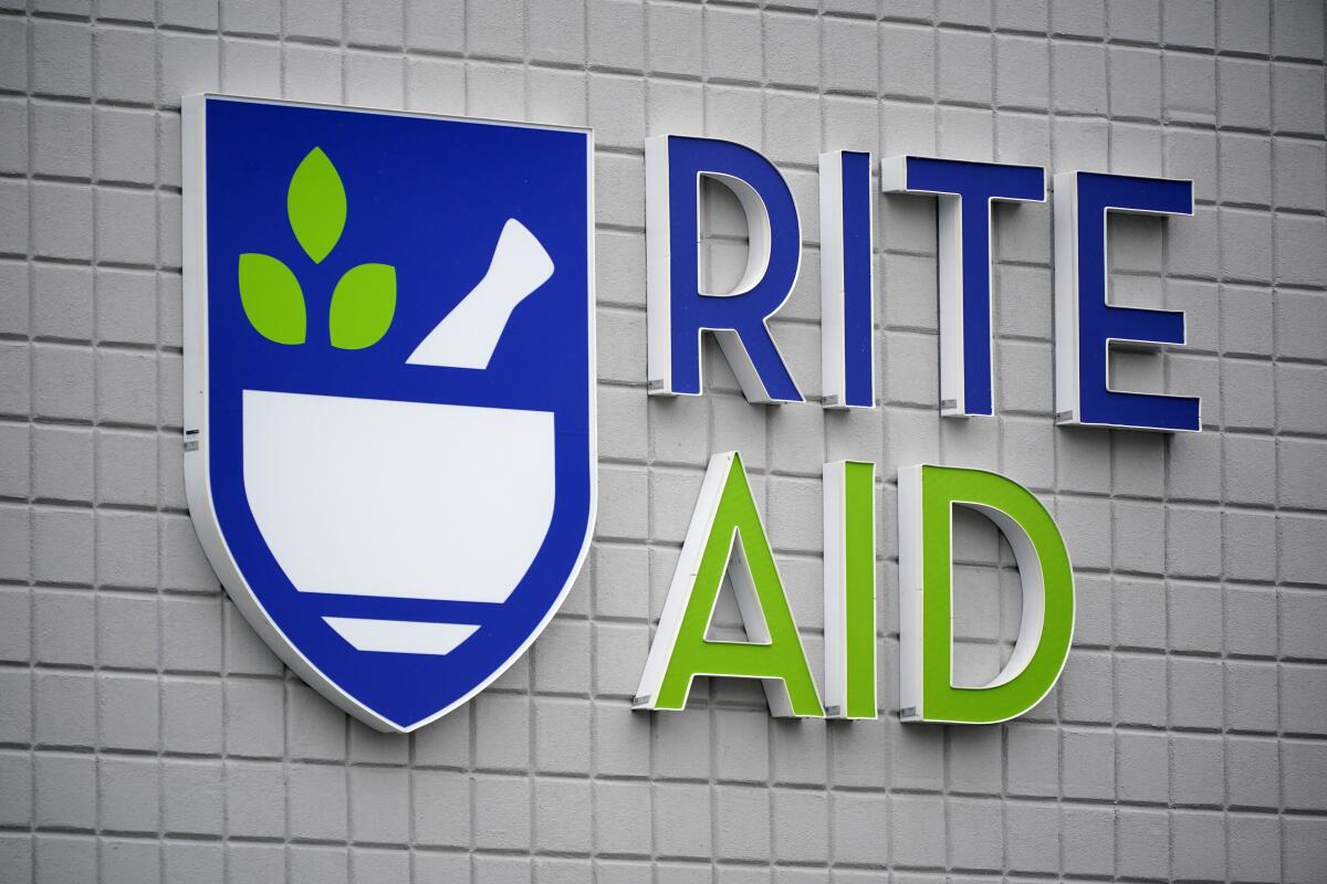 The words "Rite Aid" are on a wall.