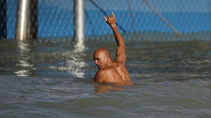 Kelly Slater gives a shaka sign after a long tube ride at Surf Ranch, which is hosting its first World Surfing League competition this weekend.