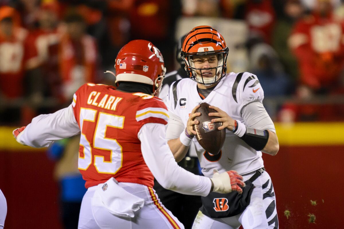 Chiefs defensive end Frank Clark readies to sack  Bengals quarterback Joe Burrow during the AFC championship game.