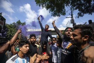 Protesters shout slogans as they celebrate after getting the news of Prime Minister Sheikh Hasina's resignation, in Dhaka, Bangladesh, Monday, Aug. 5, 2024. (AP Photo/Rajib Dhar)