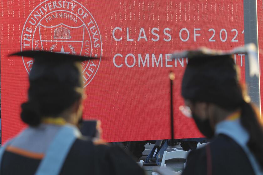 FILE - Graduates of the University of Texas Rio Grande Valley attend their commencement ceremony at the schools parking lot on Friday, May 7, 2021, in Edinburg, Texas. New rules proposed by the Biden administration on Wednesday, July 6, would make it easier for borrowers to get their federal student debt forgiven through several existing programs. (Delcia Lopez/The Monitor via AP, File)