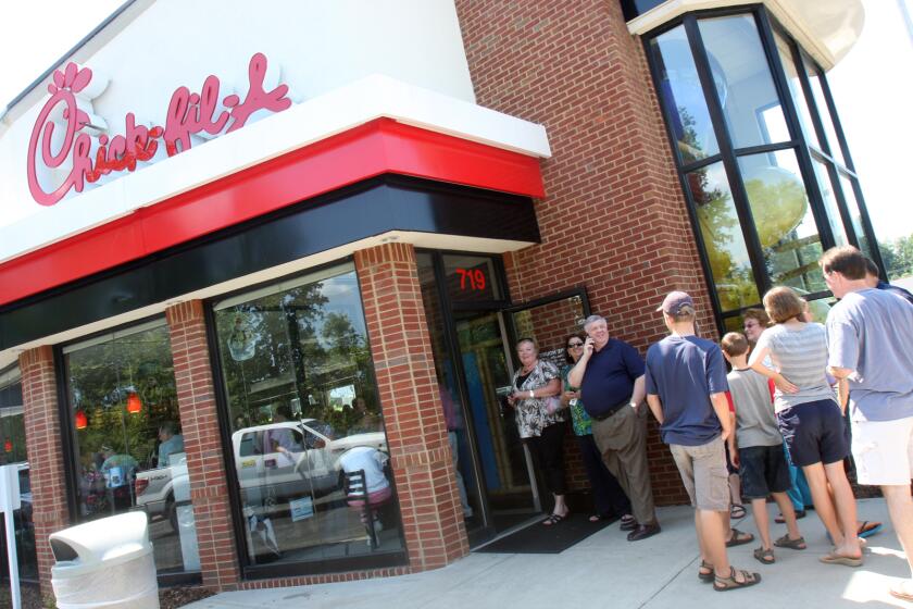 Customers wait on line outside the door of the Chick-fil-A on Wednesday, Aug. 1. 2012 in Shelby, N.C. Supporters of Chick-fil-A are planning to eat at restaurants in the chicken chain as the company continues to be criticized for an executive's comments about gay marriage. Former Arkansas Gov. Mike Huckabee, a Baptist minister, declared Wednesday national "Chick-fil-A Appreciation Day." Opponents of the company's stance are planning "Kiss Mor Chiks" for Friday, when they are encouraging people of the same sex to show up at Chick-fil-A restaurants around the country and kiss each other. (AP Photo/The Star, Ben Earp)