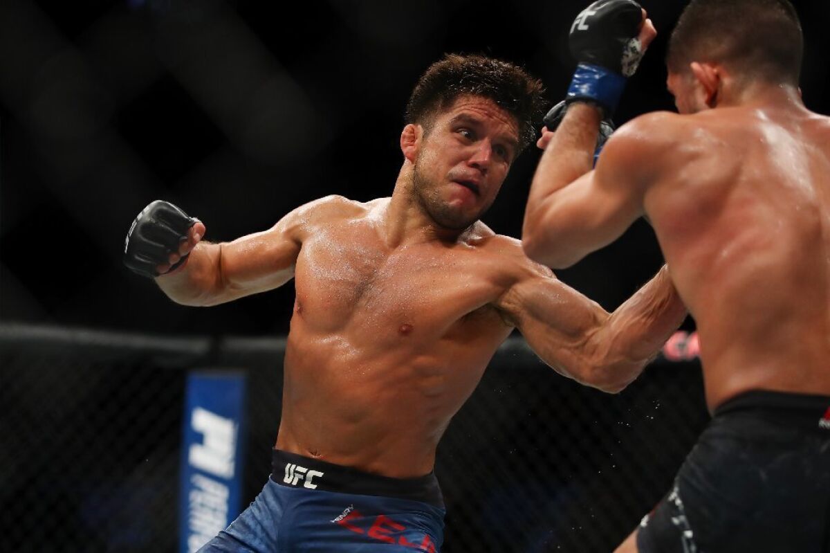 Henry Cejudo goes after Sergio Pettis during their flyweight fight at UFC 218.
