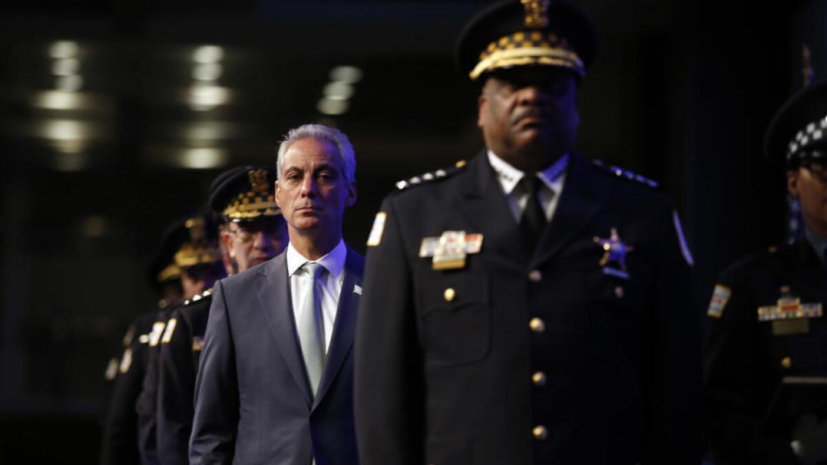 Chicago Mayor Rahm Emanuel, center, and Police Supt. Eddie Johnson in May.