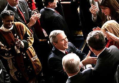 President Bush is greeted on Capitol Hill prior to giving his State of the Union address. Rep.Cynthia McKinney, D-Ga. is at left.