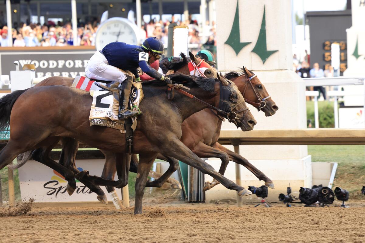 Mystik Dan, on the inside, wins the 150th running of the Kentucky Derby by a nose with jockey Brian J. Hernandez Jr.