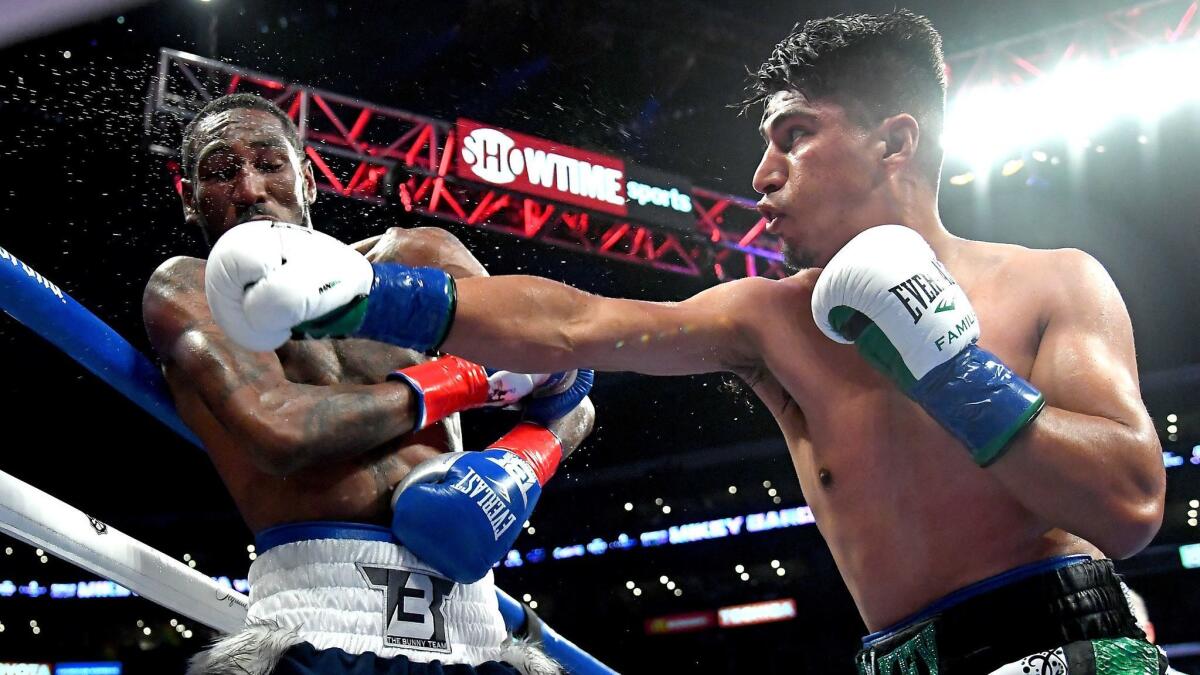 Mikey Garcia, right, battles Robert Easter Jr. at Staples Center on July 28.