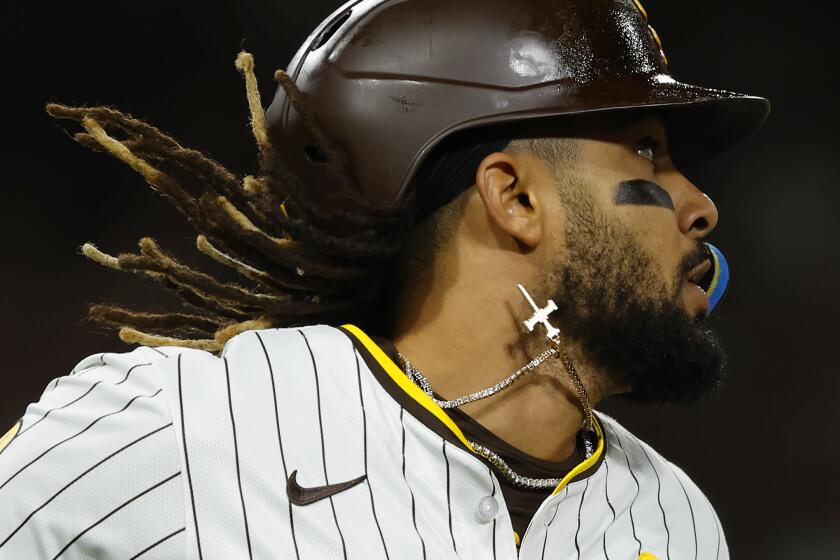 San Diego CA - April 2: San Diego Padres' Fernando Tatis Jr. runs to first base after hitting a single in the fifth inning against the St. Louis Cardinals at Petco Park on Tuesday, April 2, 2024. (K.C. Alfred / The San Diego Union-Tribune)