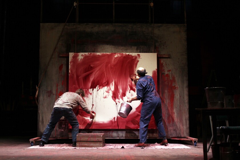 Painter Mark Rothko (Mark Harelik), right, and his assistant, Ken (Paul David Story), prime a canvas together in South Coast Repertory's new production of John Logan's "Red."