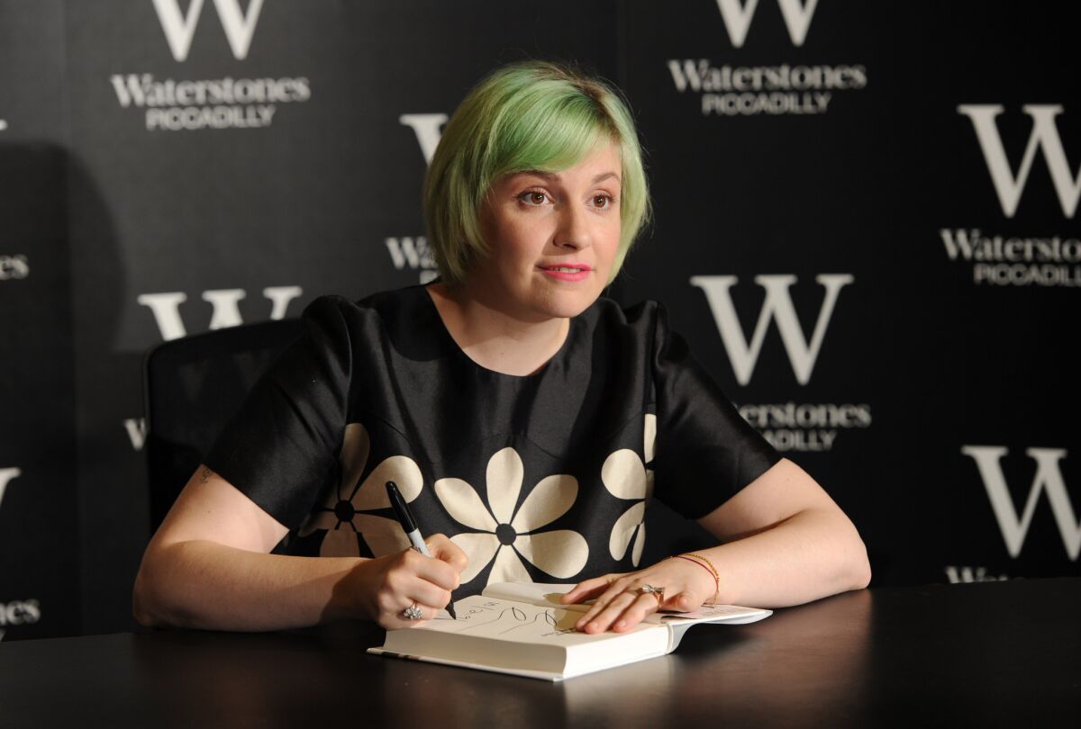 Lena Dunham meets fans and signs copies of her book "Not That Kind of Girl" in London.