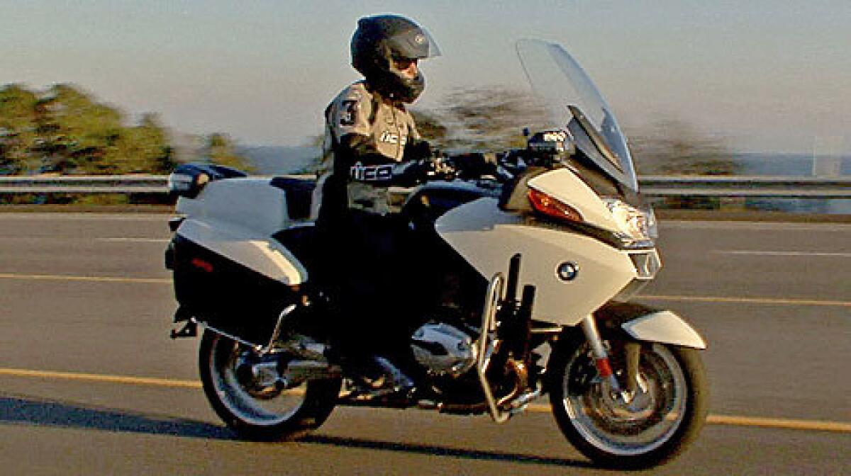 ON PATROL: Susan Carpenter takes a spin on the BMW R1200RT-P. The paint screams motorcycle cop.
