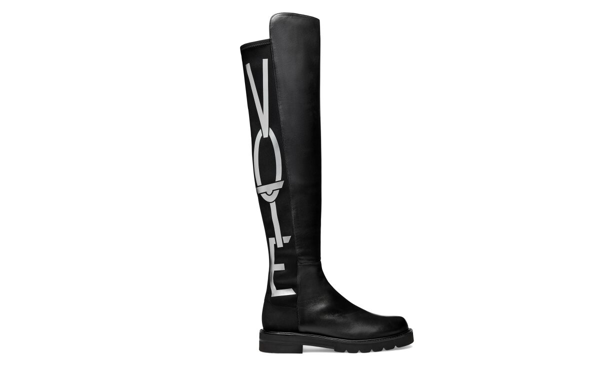 Stuart Weitzman's limited-edition 5050 Vote boot with I Am a Voter with "VOTE" in capital letters up the side.