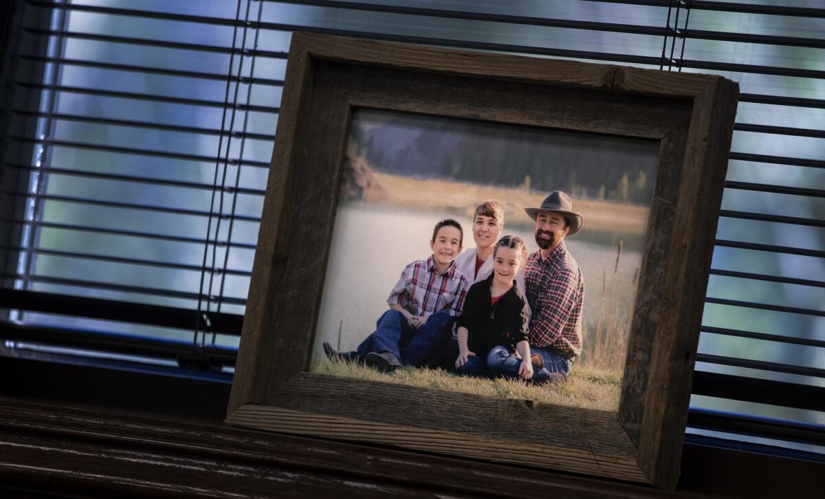 A family portrait in Utah County Commissioner Nathan Ivie's office in Provo, Utah.