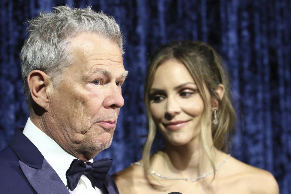 A close-up of David Foster and wife Katharine McPhee in formalwear