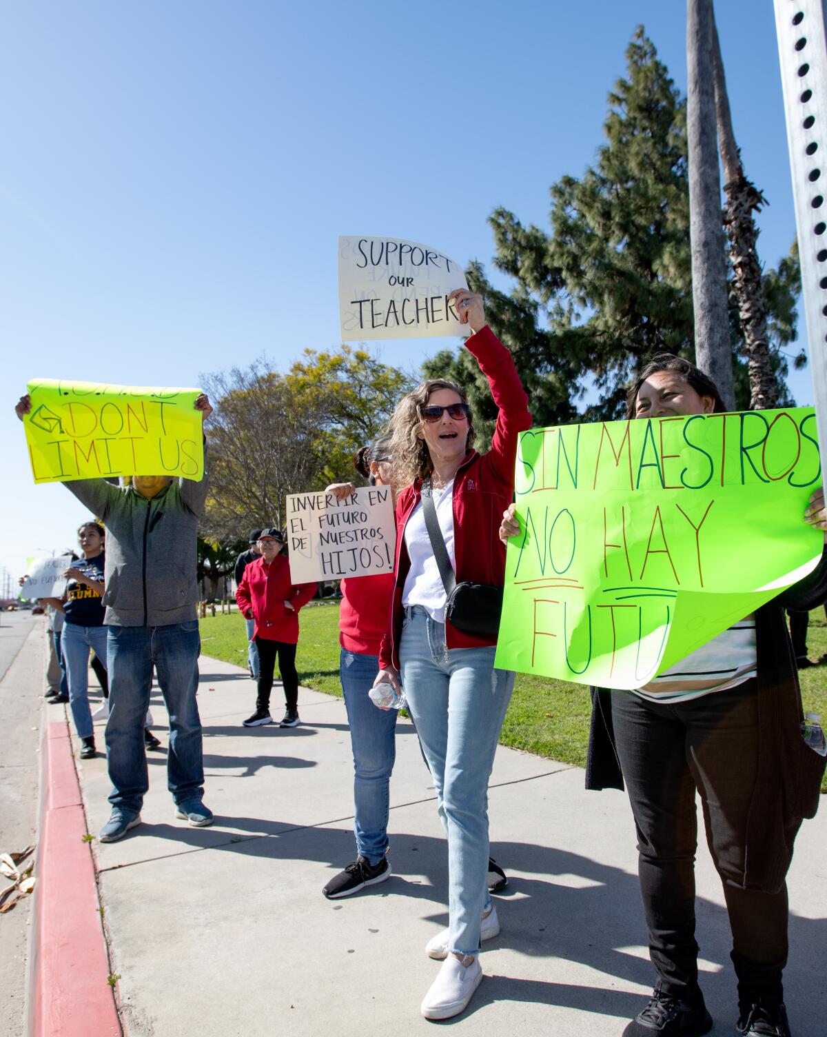 Students and parents protest planned layoffs near Brookhurst Junior High Thursday, March 14.