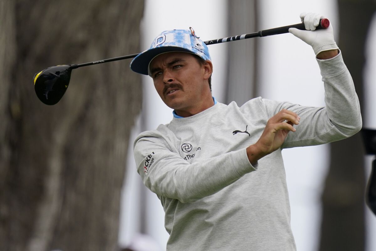 Rickie Fowler watches his tee shot on the seventh hole during the first round of the PGA Championship golf tournament at TPC Harding Park Thursday, Aug. 6, 2020, in San Francisco. (AP Photo/Jeff Chiu)