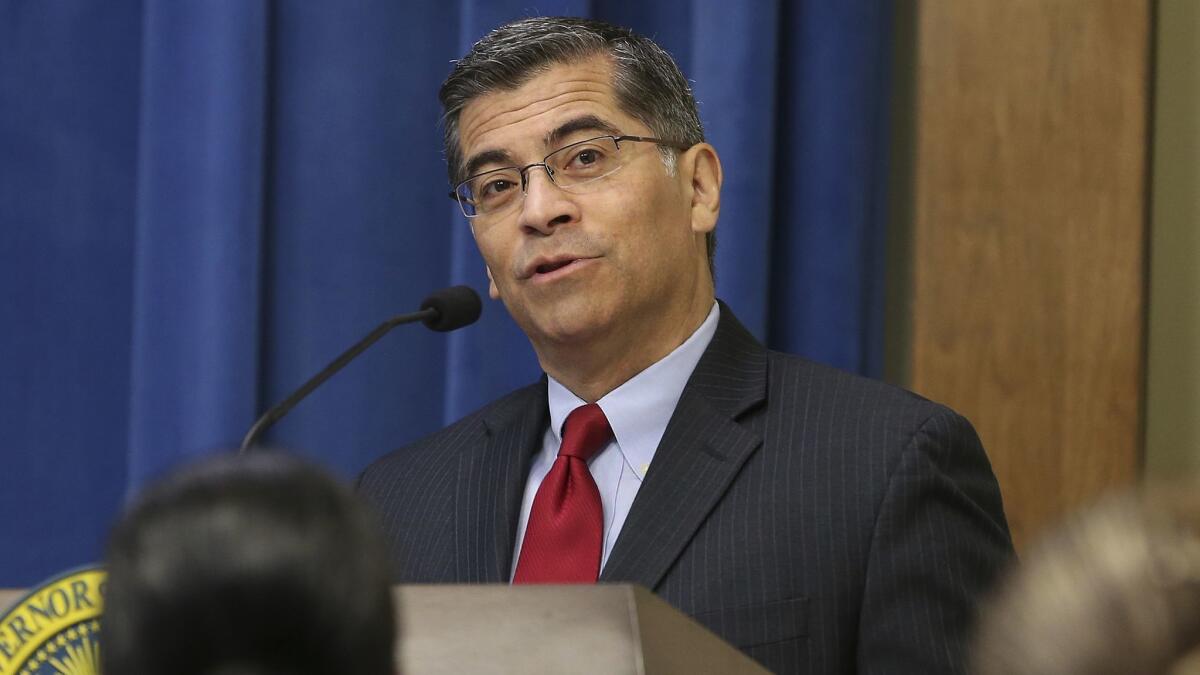 California Atty. Gen. Xavier Becerra, seen in 2018, is asking a judge to put a hold on the sale of two struggling hospitals in Santa Clara County — a move the county's chief executive says could result in the struggling hospitals having to close.