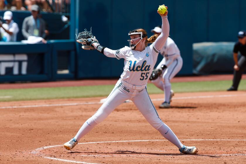 UCLA pitcher Kaitlyn Terry delivers against Oklahoma in the Women's College World Series on June 1, 2024.
