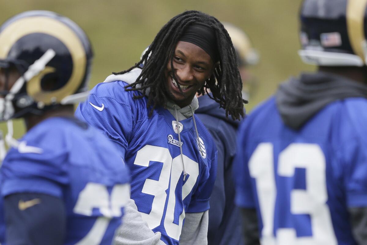 Rams running back Todd Gurley smiles as he takes part in a practice session at Pennyhill Park Hotel in Bagshot, England on Oct. 21.