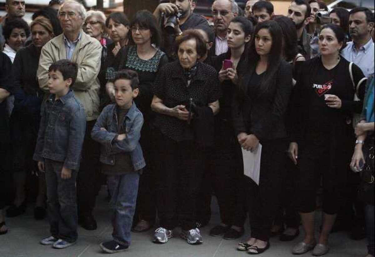 Armenian residents congregate in front of Burbank City Hall to commemorate the lives that were lost during the Armenian genocide at a memorial candle lighting on Tuesday, April 23, 2013.