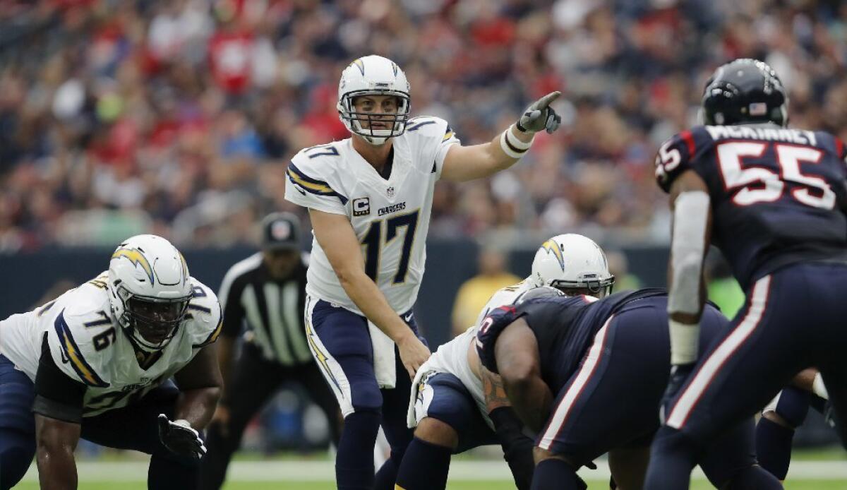 Chargers quarterback Philip Rivers yells out signals from the line of scrimmage during a game against the Texans on Nov. 27.