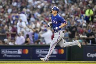 Texas Rangers' Corey Seager rounds the bases after a two-run home run.