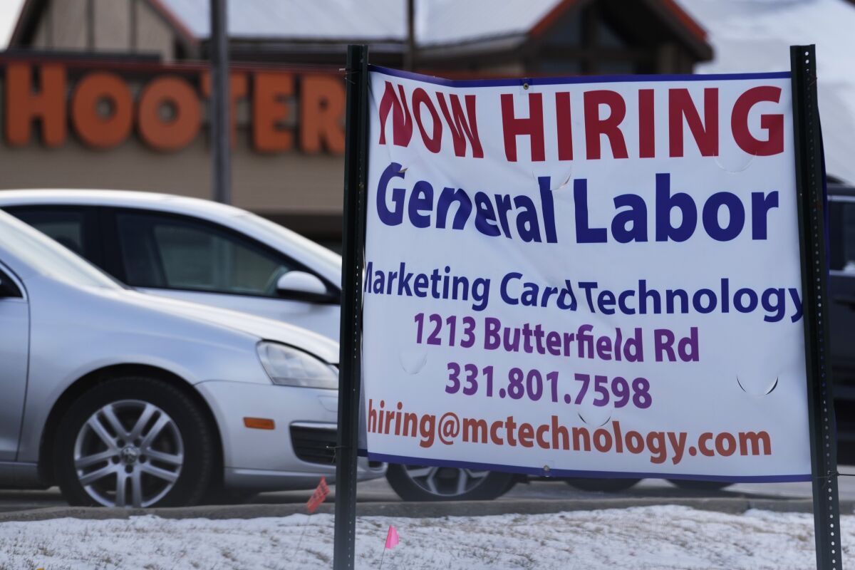 File - A hiring sign is seen in Downers Grove, Ill., Thursday, May 5, 2022. On Thursday, the Labor Department reports on the number of people who applied for unemployment benefits last week. (AP Photo/Nam Y. Huh, File)