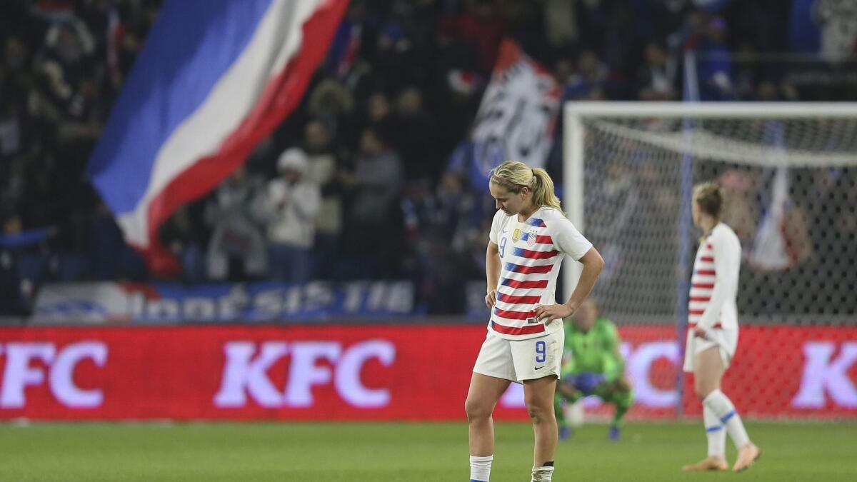 U.S. midfielder Lindsey Horan stands on the field after France scored its third goal during a women's international friendly soccer match between France and United States at the Oceane stadium in Le Havre, France.