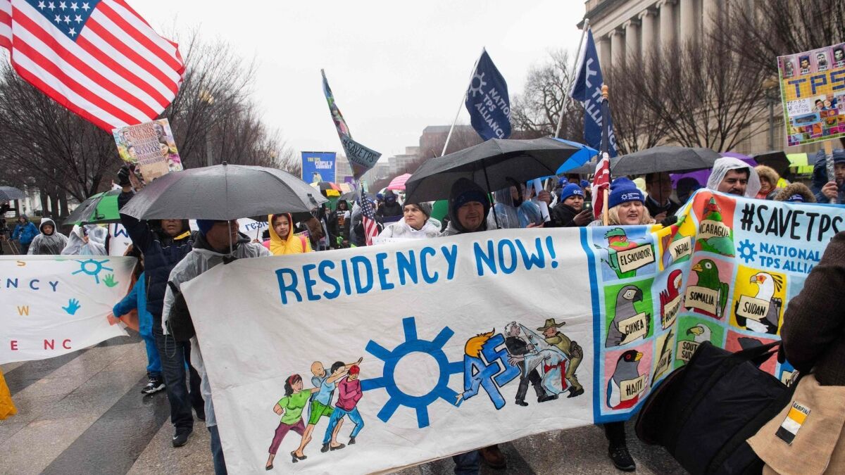 Demonstrators participate in the March for TPS Justice outside the White House in Washington on Feb. 12, 2019.
