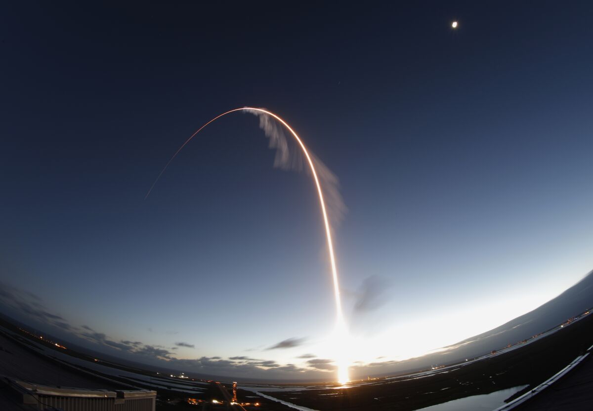 A rocket flying through the night sky.