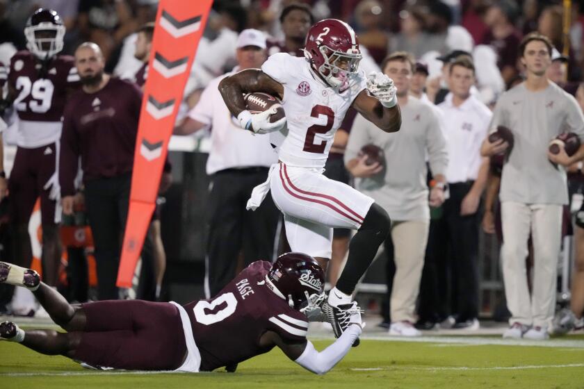 Alabama running back Jase McClellan (2) is tackled by Mississippi State linebacker DeShawn Page (0) after a short run during the first half of an NCAA college football game, Saturday, Sept. 30, 2023, in Starkville, Miss. (AP Photo/Rogelio V. Solis)