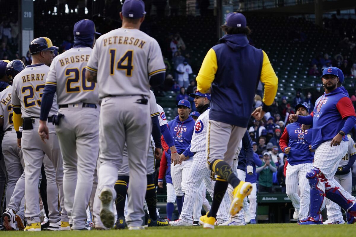 Milwaukee Brewers and Chicago Cubs benches clear after Milwaukee Brewers' Andrew McCutchen was hit by a pitch from Chicago Cubs relief pitcher Keegan Thompson during the eighth inning of a baseball game in Chicago, Saturday, April 9, 2022. (AP Photo/Nam Y. Huh)