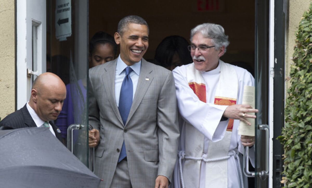 President Obama exits St. John's Episcopal Church with the Rev. Luis Leon after he and the first family attended Easter services in Washington, D.C.